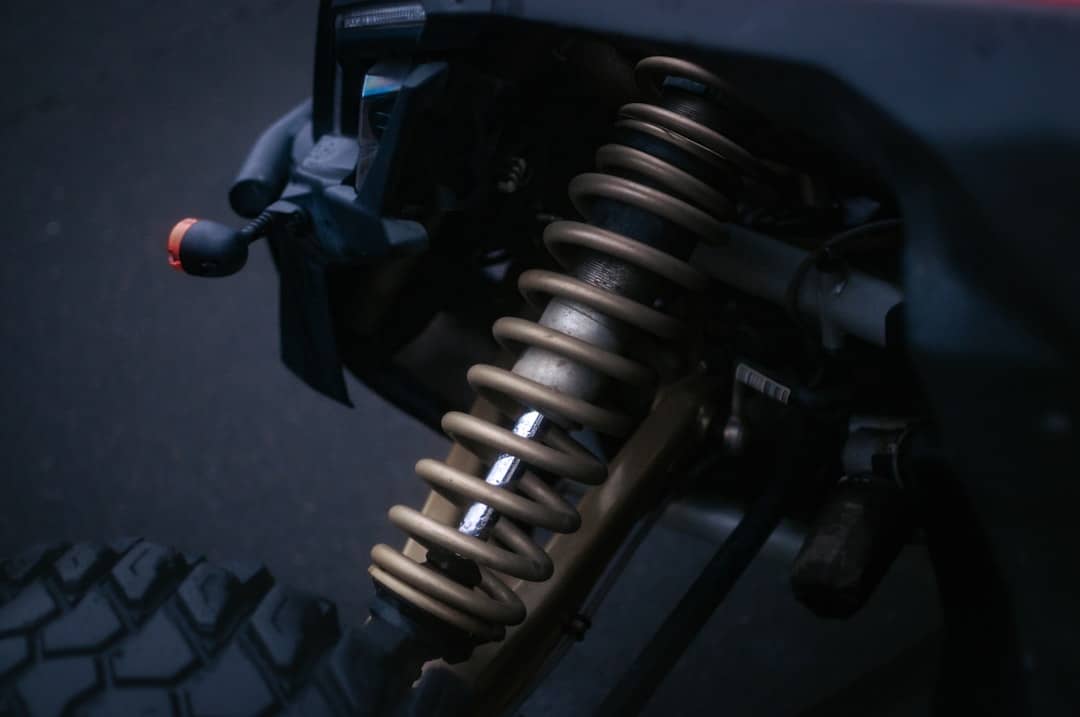 Close-up of a vehicle's shock absorber and suspension