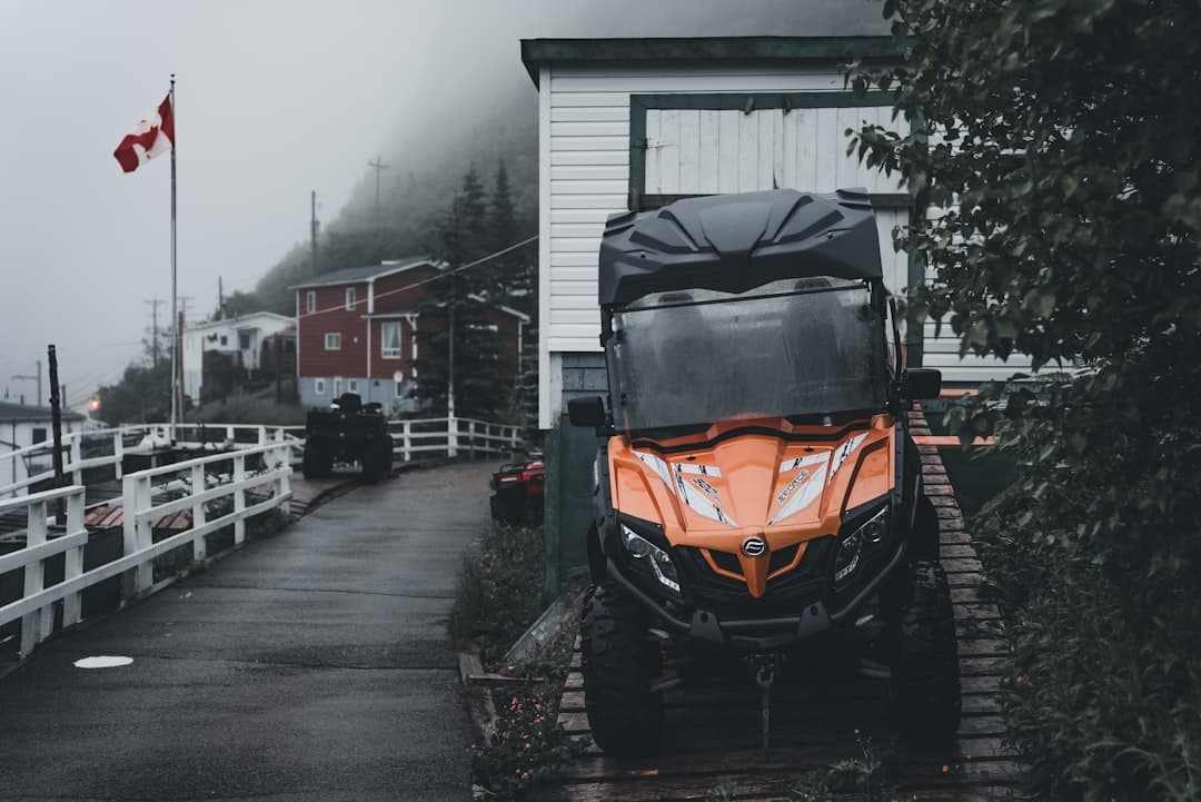 a four - wheeler parked on the side of a road
